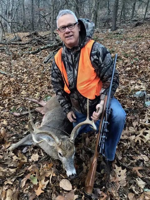 Steve next to a deer he shot